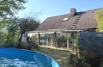 Großzügiges Wohnerlebnis mit Einliegerpotenzial: Zuhause an den Streuobstwiesen, 63517 Rodenbach, Einfamilienhaus